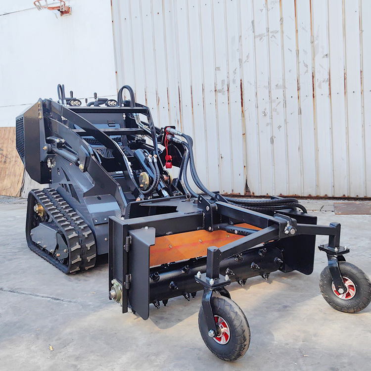 Mini skid steer loader with Harley Rake