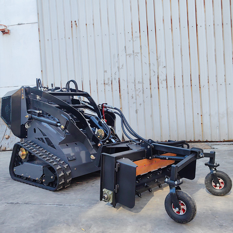 Mini skid steer loader with Harley Rake