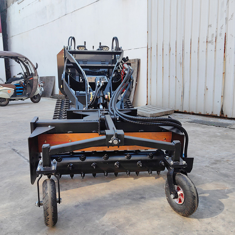 Mini skid steer loader with Harley Rake